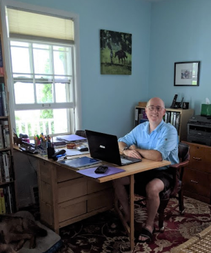 Eric Engel in his Ann Arbor office sitting behind his desk.